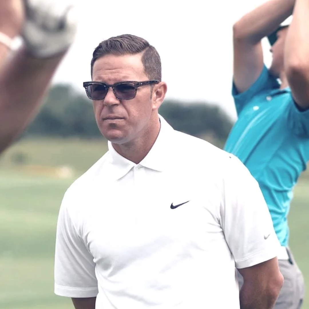 Hanah Hero Sean Foley analyzing a golfer's practice swing on the course