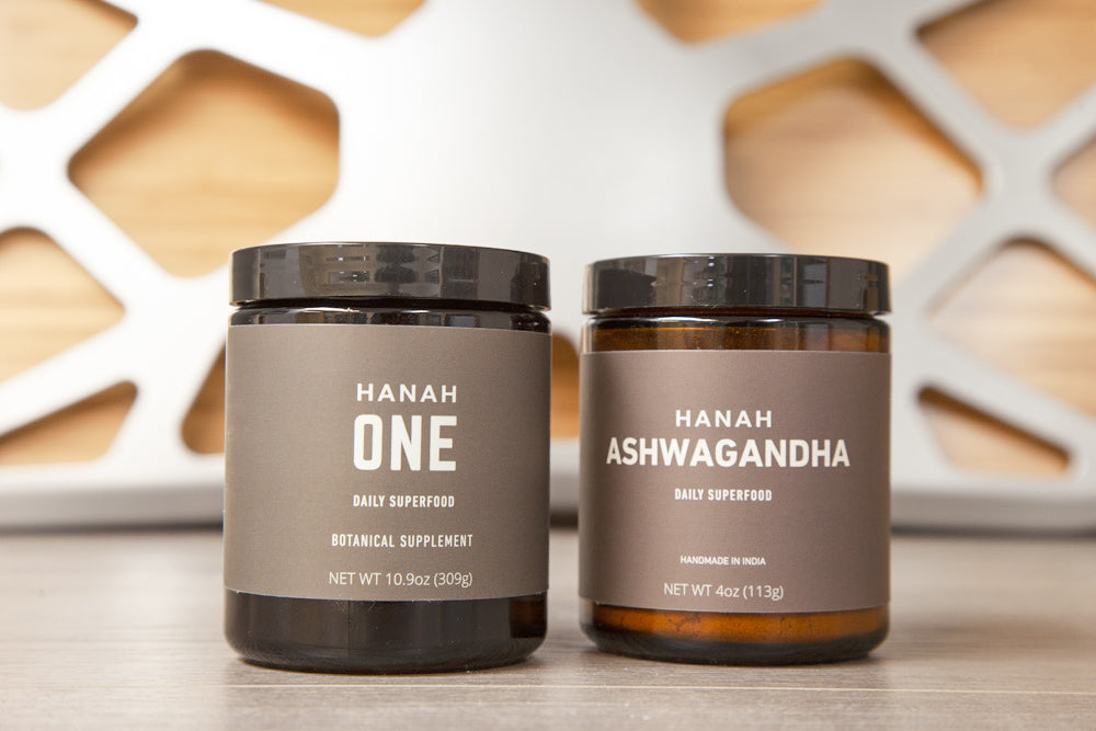 A jar of HANAH ONE and a jar of HANAH Ashwagandha side by side on a table